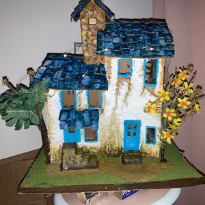 A handmade abandoned farmhouse diorama