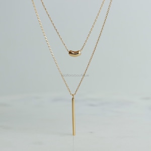 Gold Layered Necklace: Bean and Vertical Bar Pendant, Minimalist Jewelry