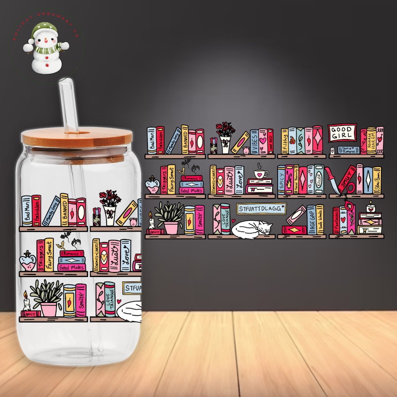 May include: A clear glass water bottle with a bamboo lid and a straw. The bottle has a colorful graphic of bookshelves with books and other decorative elements. The text on the books includes "Bad Man", "Forbidden", "Triggers", "Fairy Smut", "Banned", "Love", "Spicy", "VIBES", "Filthy", "STFUATTDLAGG", "AGE GAP", "GOOD GIRL", "SMUT", "HAREM", and more.