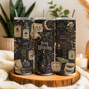 May include: A cylindrical tumbler with a metal straw featuring a dark, mystical print of apothecary bottles, crystals, moths, and books. The design includes text such as "Stay Witchy," "Magick is in everything you do," "Arsenic," and "Book of Shadows."
