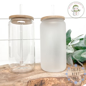 a glass jar with a wooden lid next to a glass jar with a wooden lid