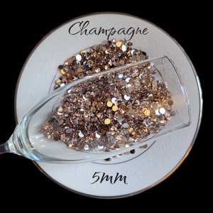 Champagne Rhinestones has a skintone color, Resin-5mm , Rhinestone for Tumblers, Nails, Embellishments, crafts and gifts.  CnJglitznglam