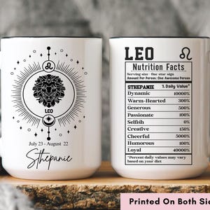 May include: White ceramic mug with black handle and rim, featuring a Leo zodiac design. One side displays a lion illustration, the other side has "Leo Nutrition Facts". Includes the name "Sthepanie" and the text "Printed On Both Sides".