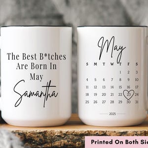 May include: White ceramic coffee mug with black trim. One side features the text "The Best B*tches Are Born In May Samantha". The other side features the word "May" with a calendar for the month of May 2025. The text "Printed On Both Sides" is printed below the mug.