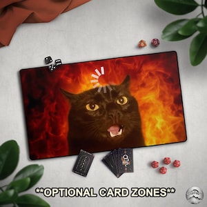 May include: A rectangular black desk mat featuring a black cat with wide yellow eyes and an open mouth against a fiery background. The mat includes the text "**OPTIONAL CARD ZONES**" and is surrounded by dice and playing cards.