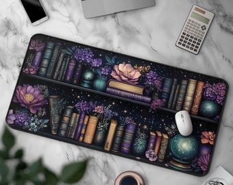 May include: A rectangular desk mat featuring a dark, starry background with two horizontal shelves filled with various books, purple and pink flowers, and a glowing crystal ball. The design includes intricate floral accents and book spines.