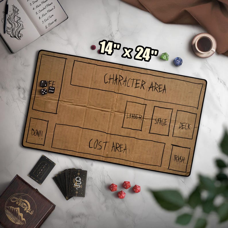 May include: A brown game mat, 14 x 24 inches, with labeled areas for gameplay. Text includes "CHARACTER AREA", "COST AREA", "LEADER", "STAGE", "DECK", and "TRASH". Dice, cards, and a notebook are also visible.