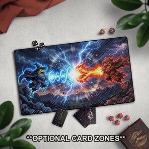 May include: A rectangular playmat featuring a fantasy battle scene with two frog wizards casting spells. One frog is in blue, the other in red. The mat has the text "**OPTIONAL CARD ZONES**" at the bottom. Dice and cards are also visible.