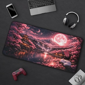 May include: A white ceramic mug with a black handle and the text "But First, Coffee" in a black, handwritten-style font. The mug is on a white surface.