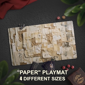 May include: A rectangular playmat featuring a collage of various aged, torn, and layered paper scraps in shades of beige, cream, and brown. The design includes grid paper, lined notebook sheets, and blank fragments. Text reads: "PAPER" PLAYMAT 4 DIFFERENT SIZES.