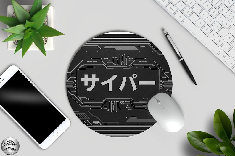 May include: A round black mouse mat featuring a circuit board design and Japanese text. The word "cyber" is written in white. A white mouse, keyboard, pen, and smartphone are also visible.