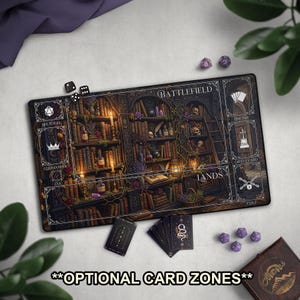 May include: A rectangular game mat with a detailed fantasy library design, featuring bookshelves, skulls, and candles. The mat includes zones for battlefield, lands, and other game elements. Dice and cards are scattered around the mat. Text on the mat reads "Battlefield" and "Lands".