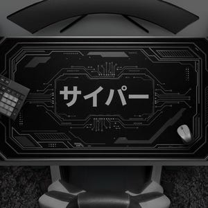 May include: Black desk mat with a circuit board design and Japanese text. The mat features a keyboard, mouse, and a game controller. A curved monitor and speakers are visible in the background.