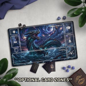 May include: A rectangular playmat featuring a detailed illustration of a dragon in a cosmic ocean setting. The mat has designated zones for cards and dice, with text labels like "Battlefield" and "Lands." Additional dice and cards are scattered around the mat.