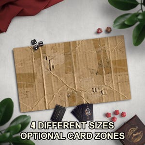 May include: A brown, rectangular cardboard game board with the text "4 DIFFERENT SIZES OPTIONAL CARD ZONES". The image includes dice, playing cards, and a wooden box, suggesting a tabletop game theme.