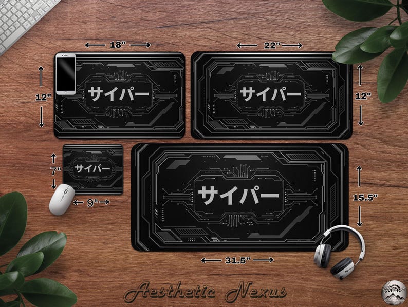May include: Four black computer desk mats with a circuit board design and the Japanese word "Cyber". The mats measure 45.7 cm x 30.5 cm, 55.9 cm x 30.5 cm, 80 cm x 39.4 cm, and 22.9 cm x 17.8 cm. A smartphone, mouse, and headphones are also visible.