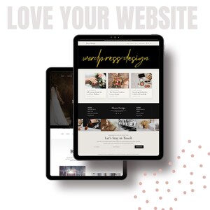 May include: Two black tablets displaying website designs. The larger tablet shows a website with the text "wordpress design" in gold script. The smaller tablet displays a website with a photo of a bride. The words "LOVE YOUR WEBSITE" are at the top.