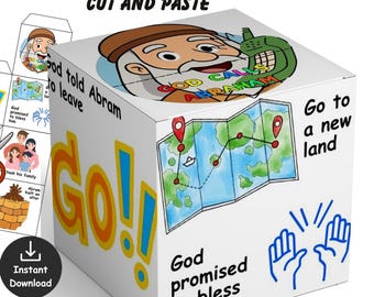 May include: A white cube with illustrations and text related to the story of Abraham. The cube features a map, the words "Go!" and "God calls Abraham." A pair of scissors and a cut-out are also shown.