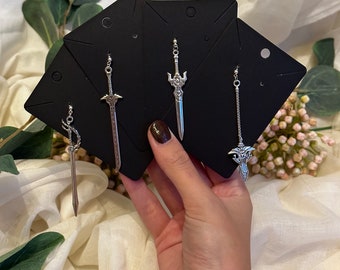 Various handmade sword earrings