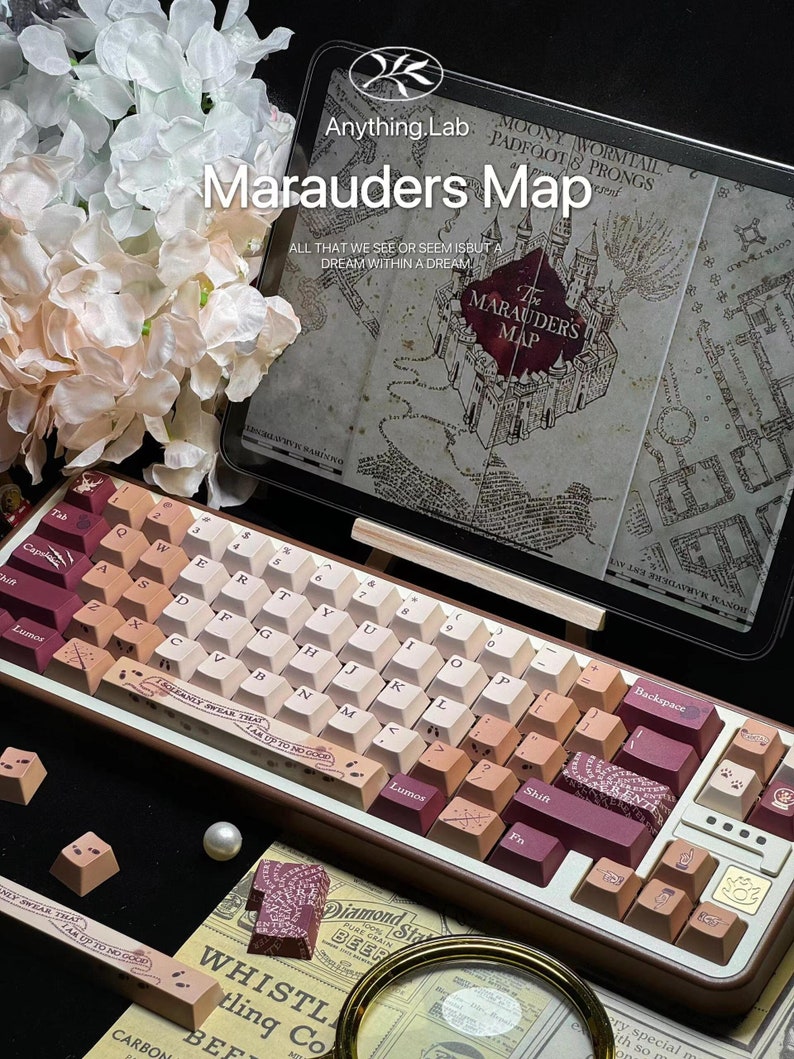May include: A custom mechanical keyboard with a gradient keycap design in shades of brown, beige, and burgundy. The keyboard features the text "Marauders Map" and "Anything Lab". A map design is visible in the background.