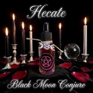 May include: A clear glass dropper bottle featuring a pink pentagram symbol, adorned with a silver triple moon charm and twine. The text Hecate and Black Moon Conjure appears in white script. The bottle is surrounded by lit candles and rose petals.