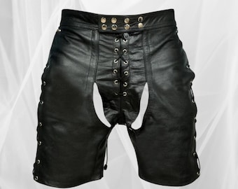 May include: Black leather shorts with a lace-up front and side panels. The shorts have a high waist and a cut-out design in the back.
