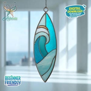 May include: A stained glass wave design in shades of blue, teal, and white, suspended by a chain. The artwork is in an oval shape with a dark metal frame. Text on the image reads "DIGITAL DOWNLOAD NO PHYSICAL ITEM WILL BE SHIPPED" and "BEGINNER FRIENDLY".