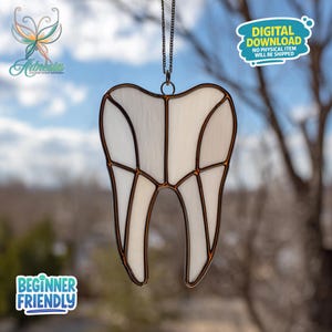 May include: A stained glass tooth with a white interior and brown outlining, hanging from a chain. The image includes text that says "Digital Download" and "Beginner Friendly".