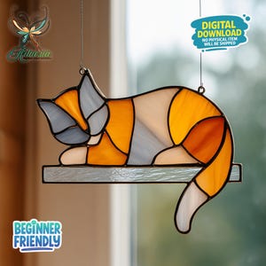 May include: Stained glass cat suncatcher in orange, white, and gray. The cat is lying down on a shelf. The image includes the text "DIGITAL DOWNLOAD NO PHYSICAL ITEM WILL BE SHIPPED" and "BEGINNER FRIENDLY".