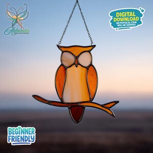 May include: Stained glass owl hanging decoration. The owl is perched on a branch and is made of orange, white, and brown glass. The owl is suspended by a chain. The text "DIGITAL DOWNLOAD NO PHYSICAL ITEM WILL BE SHIPPED" is visible.