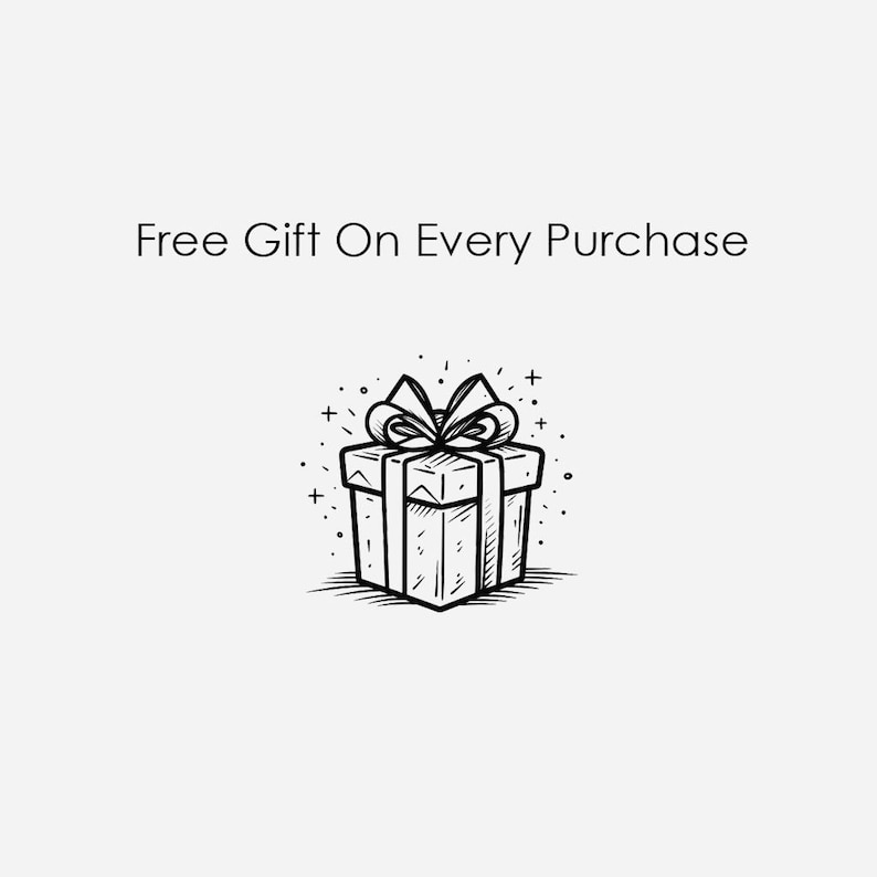 May include: A black and white illustration of a gift box with a bow on top. The text "Free Gift On Every Purchase" is above the gift box.