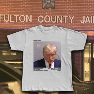 TRUMP MUGSHOT SHIRT with charges