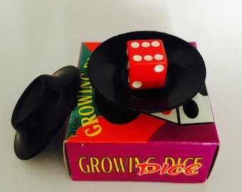 Growing Dice Close up Magic trick . A miniature dice magically transforms in a Large Dice and changes colour too.