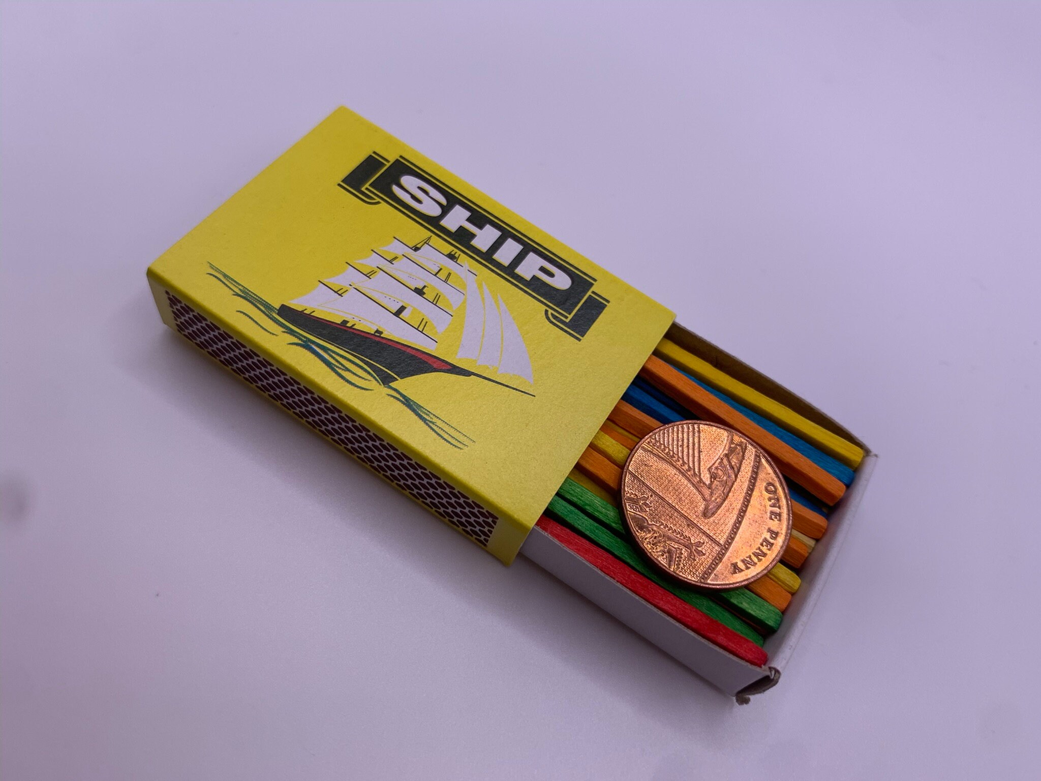 Pentro Penny Close up magic trick. Penny coin vanishes and appears from inside the box.