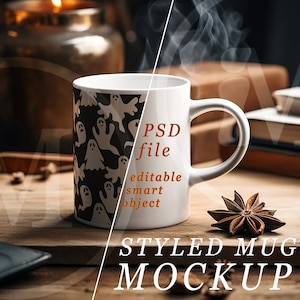 May include: A white ceramic mug with a black and white ghost pattern. The mug is on a wooden surface with a star anise, cinnamon sticks, and a lit candle in the background. Text on the mug reads "PSD file, editable smart object". The words "STYLED MUG MOCKUP" are at the bottom.