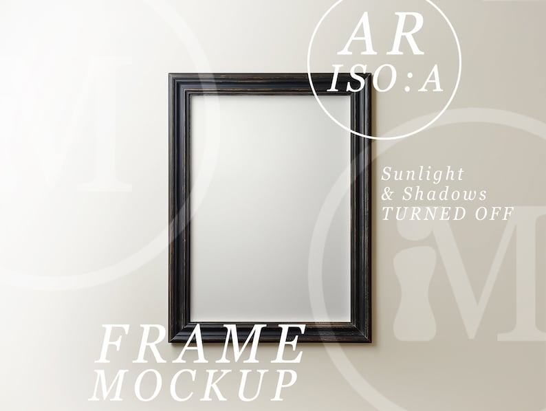 May include: A black picture frame mockup on a white wall. The frame is empty and has a simple design. The text "FRAME MOCKUP" is below the frame.