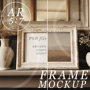 May include: White frame mockup with a landscape painting inside. The frame is on a brown surface with two white vases with dried flowers on either side. The text "PSD file, editable smart object" is visible inside the frame.