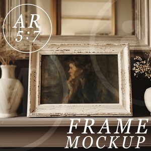 May include: White wooden frame with a distressed finish, displaying a vintage painting of a woman in a dark dress. The frame is sitting on a brown shelf with two white vases and dried flowers.