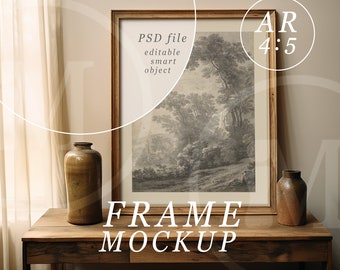 May include: A wooden frame mockup with a black and white landscape print inside. The frame is sitting on a wooden table with two brown ceramic vases.