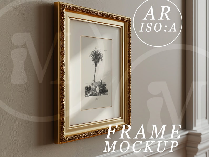 May include: A gold-colored ornate picture frame with a black and white print of a palm tree inside. The frame is hanging on a light beige wall.