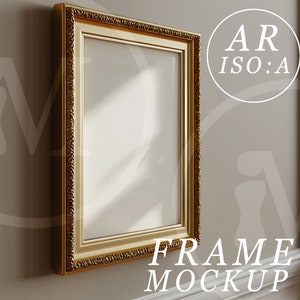 May include: A gold-colored ornate picture frame hangs on a wall. The frame is empty and ready for a photo or artwork.  FRAME MOCKUP