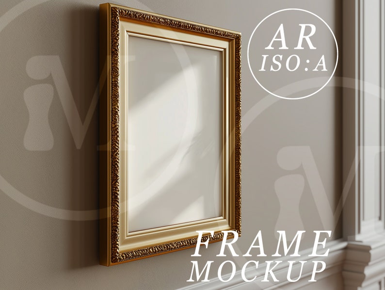 May include: A gold-colored ornate picture frame hangs on a wall. The frame is empty and ready for a photo or artwork.  FRAME MOCKUP