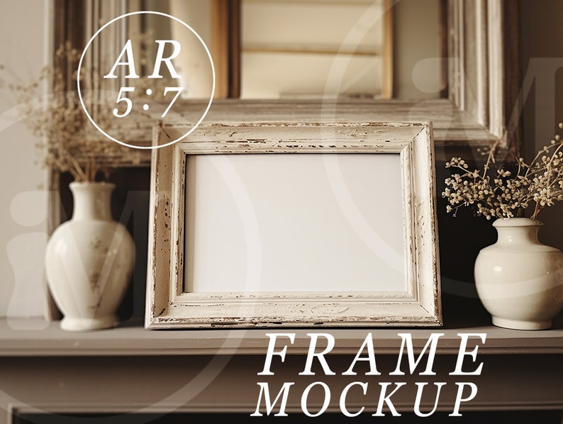 May include: A white picture frame with a distressed finish sits on a brown mantel. The frame is empty and ready for a photo or artwork. The mantel is decorated with dried flowers in white vases.