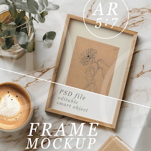 May include: A wooden frame mockup with a drawing of a sunflower inside. The frame is on a white marble surface with a cup of coffee, a potted plant, and a laptop computer. The text "PSD file editable smart object" and "FRAME MOCKUP" are visible in the image.