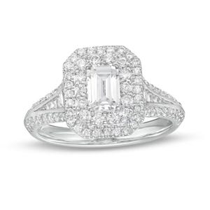 May include: A silver engagement ring featuring a large emerald-cut diamond centre stone surrounded by a double halo of smaller diamonds. The band is also set with smaller diamonds.