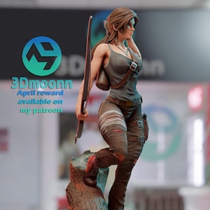 May include: A detailed 3D-printed figurine of a female character, holding a bow and arrow. She wears a gray tank top, brown pants, and boots. The figure stands on a tree stump base. The image includes the text "3Dmoonnn" and "April reward available on my patreon."