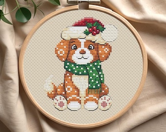 May include: Cross-stitch embroidery hoop with a cute brown and white dog wearing a red and white Santa hat and a green scarf with white polka dots.