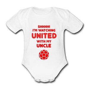 May include: White baby grow with red text that reads "Shhhh! I'm watching United with my Uncle" and a red football graphic.