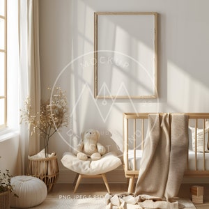 May include: A nursery room with a wooden crib, a white armchair with a teddy bear, a wicker basket with dried flowers, and a large wooden frame on the wall. The room is decorated in a neutral color palette with beige and brown tones.