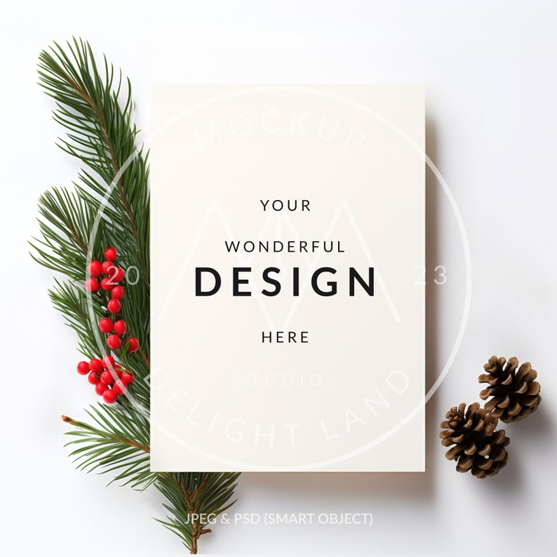 May include: A white card with the text "YOUR WONDERFUL DESIGN HERE" and the words "STUDIO ELIGHT LAND" in a circle around the text. The card is surrounded by pine branches with red berries and pine cones.